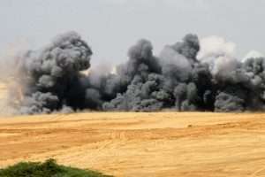 heavy smoke rises above the line of explosions created by the mine clearing 0128ca 1600