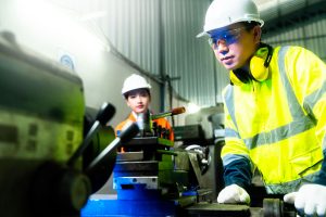 engineer cooperation two asian maintenance engineers men women inspect relay protection system with tablet device control quality control process work heavy industry manufacturing factory